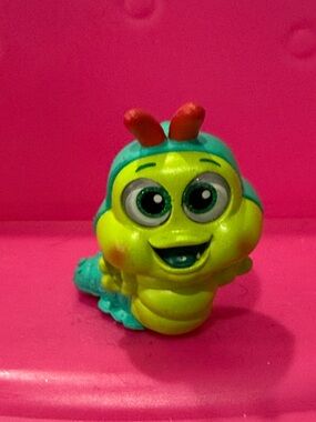 Disney Doorable Green and Teal Caterpillar Kids Toy Figure - Cute Smiling Bug